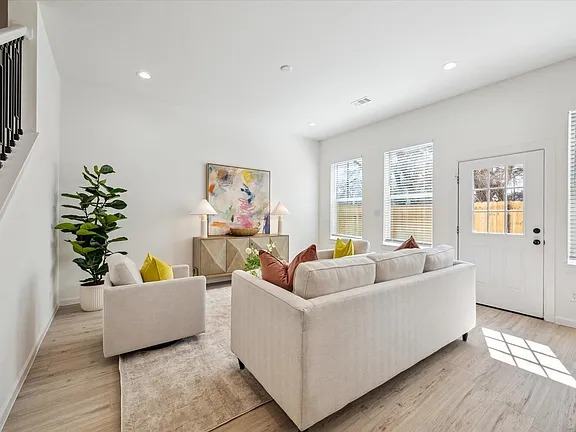 Living room with sectional seating and windows on two walls, Bianco Lane, Houston TX 77091