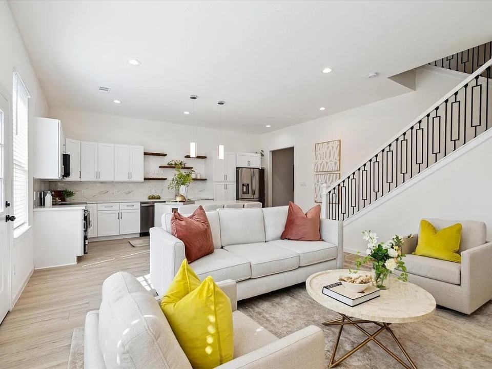 Living room beside the staircase with the kitchen behind it, Bianco Lane, Houston TX 77091