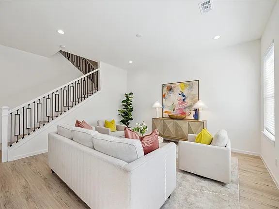 Living room seen from the entry with the stair rail on the right, Bianco Lane, Houston TX 77091