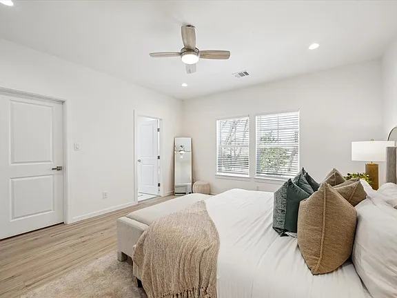 Bedroom with a ceiling fan and a window to the side yard, Bianco Lane, Houston TX 77091