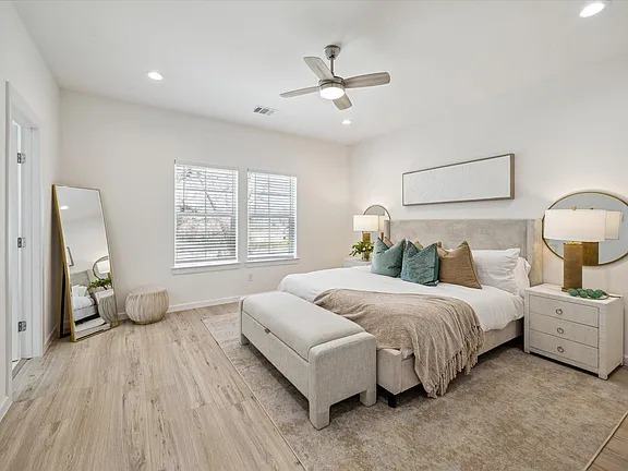 Bedroom with a full length floor mirror and side windows, Bianco Lane, Houston TX 77091