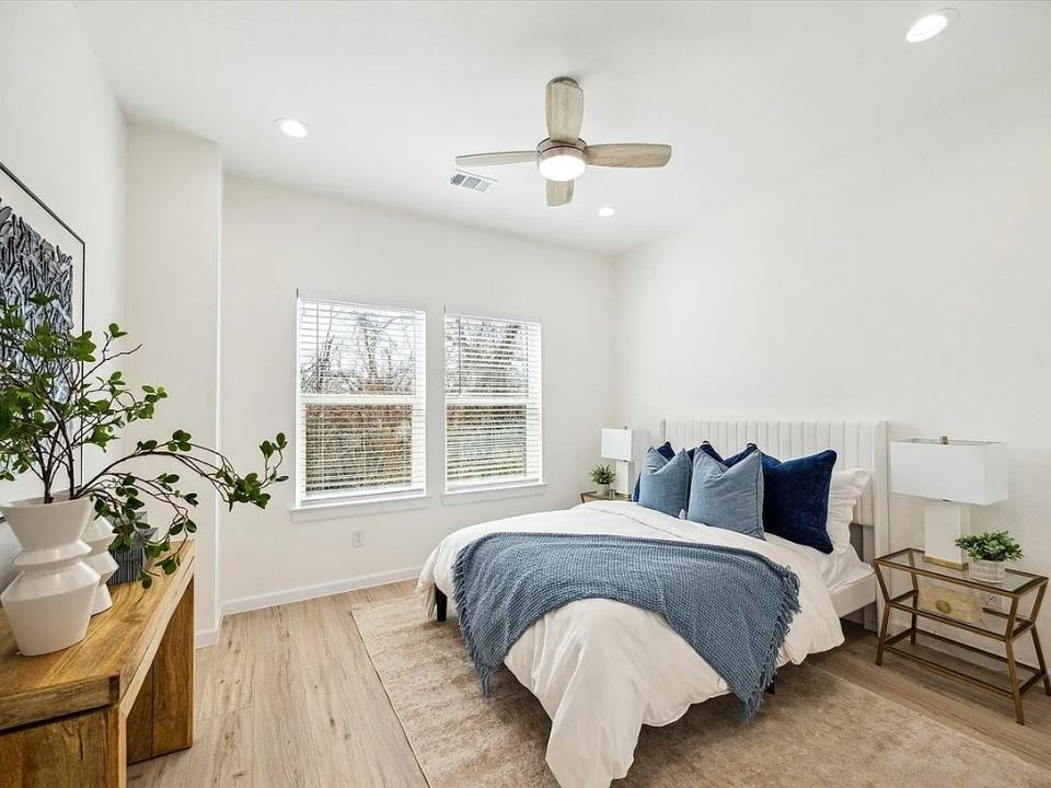 Bedroom with blue bedding and a ceiling fan, Bianco Lane, Houston TX 77091