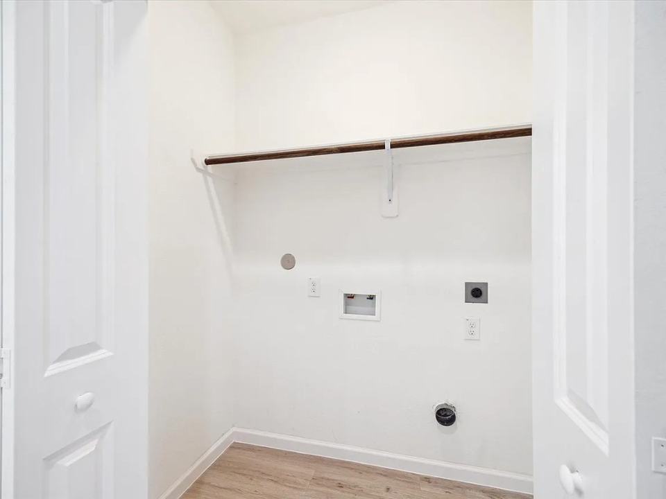 Utility room roughed in with a hanging rod, Bianco Lane, Houston TX 77091