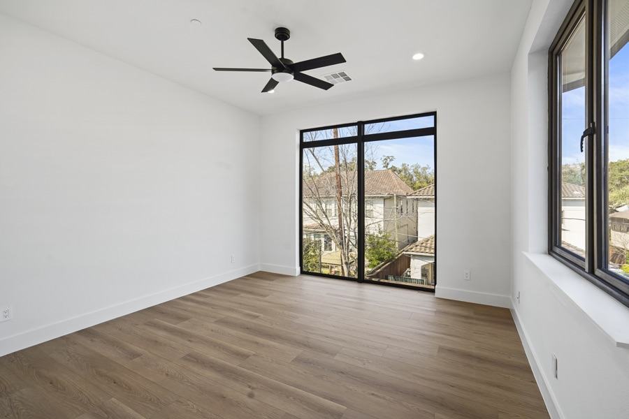 Large fixed windows in a bedroom