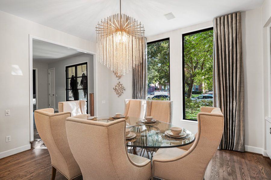 Dining room with tall dark-framed windows, Houston TX 77025