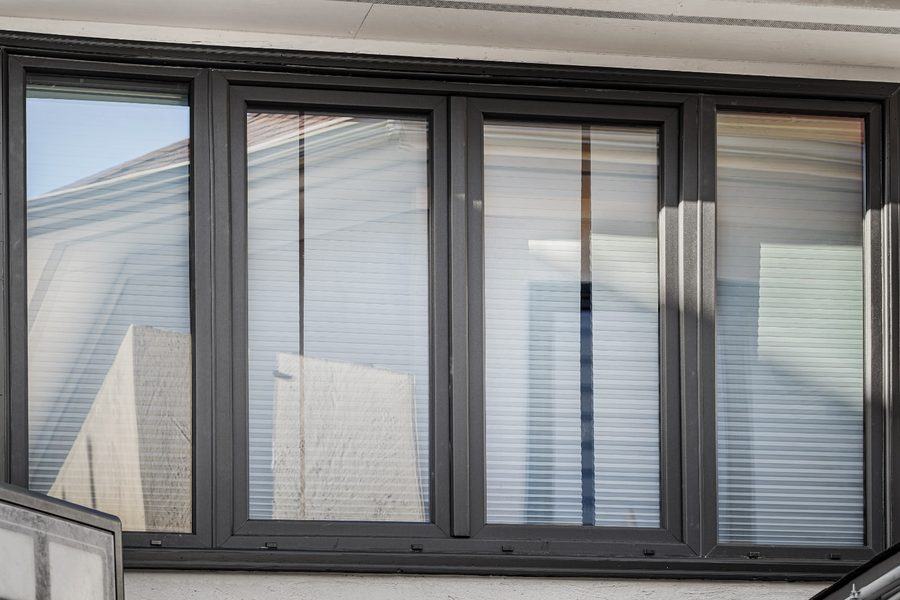 Four-unit window band on the upper floor, from outside, Houston TX 77025