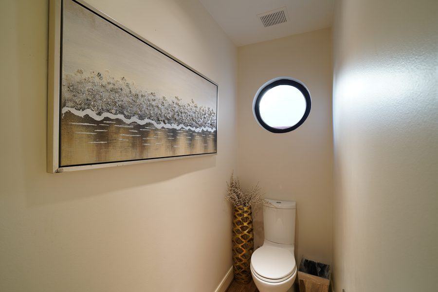 Round window in the powder room, Houston TX 77025