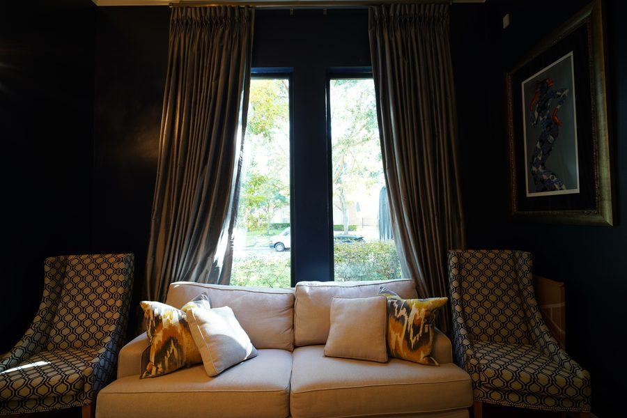 Lounge windows framed by drapes, Houston TX 77025