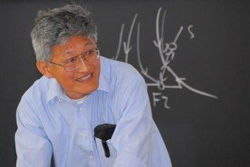 Dr. Royce K. P. Zia teaching at a blackboard