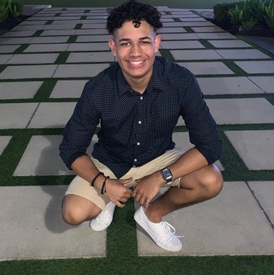 Jonathan Mesa seated outdoors in Houston