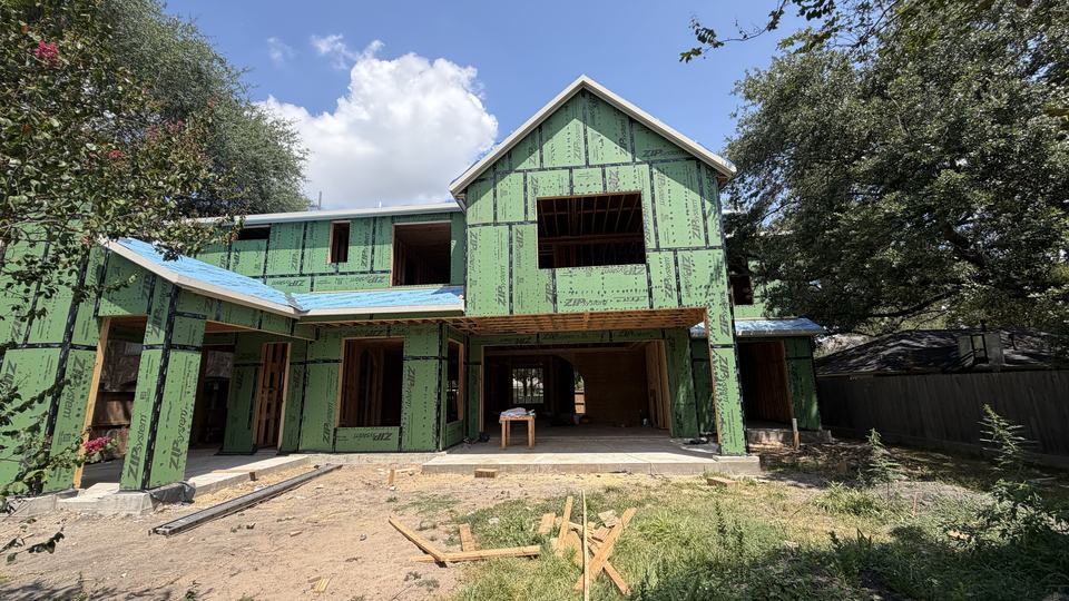 Houston new construction home with framed rough openings ready for glazing