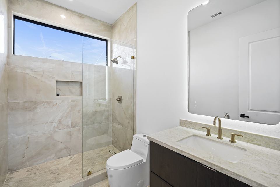 Frameless shower glass enclosure installed in a Houston bathroom