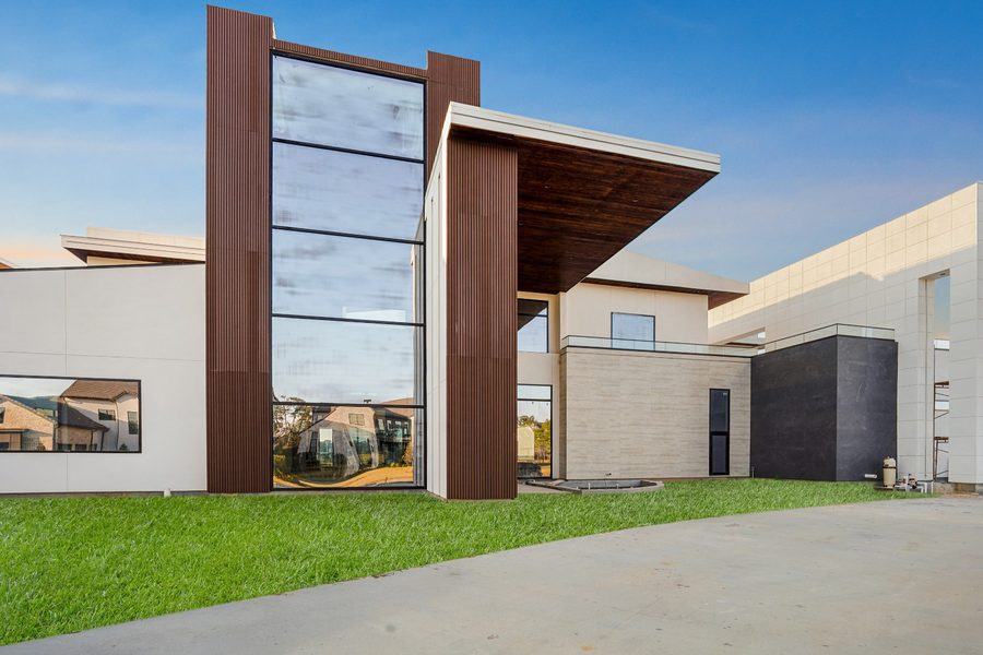 Entry tower: a full-height stack of fixed glass between timber fins, The Woodlands TX 77380