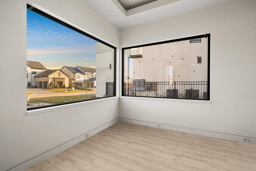 Corner room with two large fixed picture windows, The Woodlands TX 77380