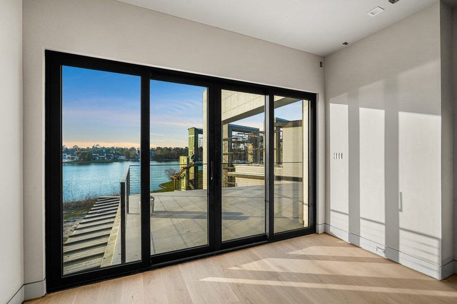 Sliding doors onto the deck, facing the water, The Woodlands TX 77380