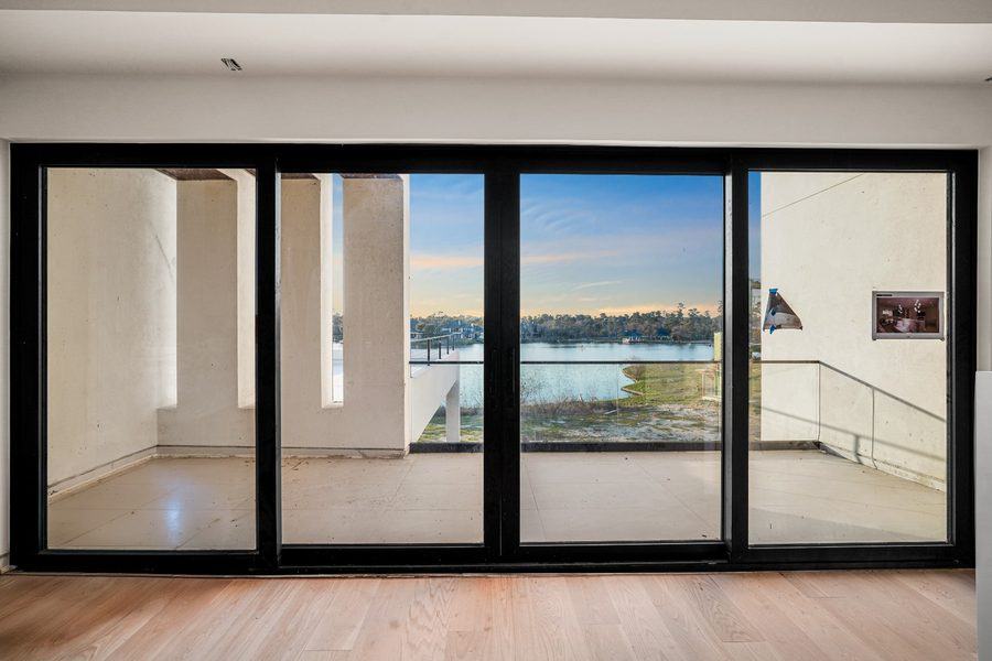 Four-panel slider framing the water view, The Woodlands TX 77380