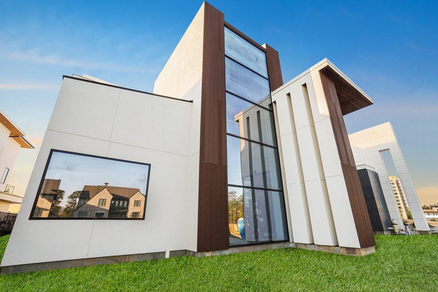 Picture window and the glazed entry tower from the lawn, The Woodlands TX 77380
