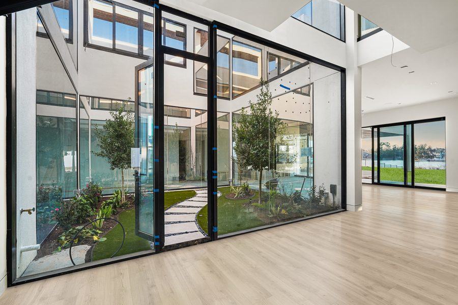 Glass walls and a door onto the interior courtyard, The Woodlands TX 77380